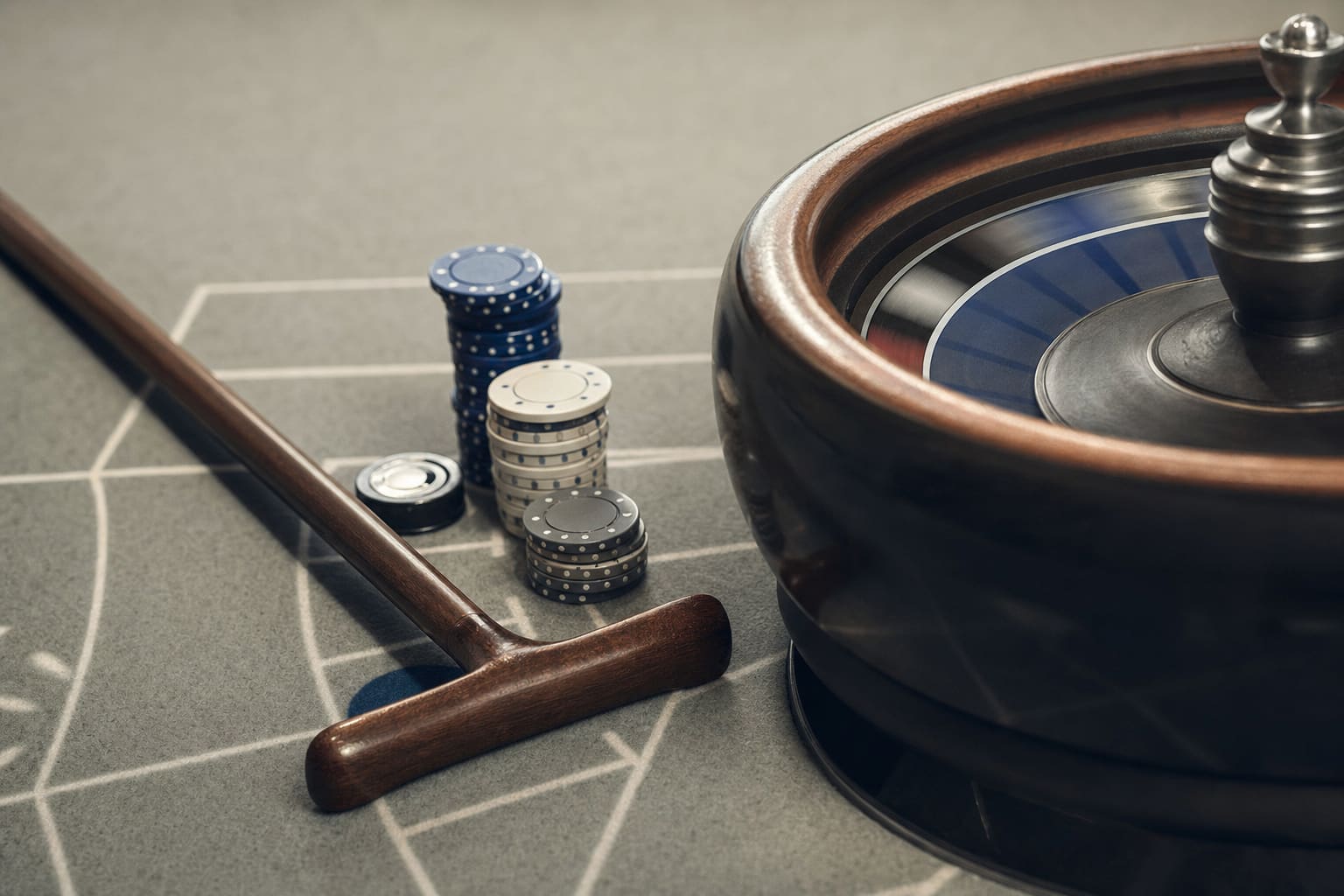 A croupier's wooden rake resting on roulette felt beside the wheel