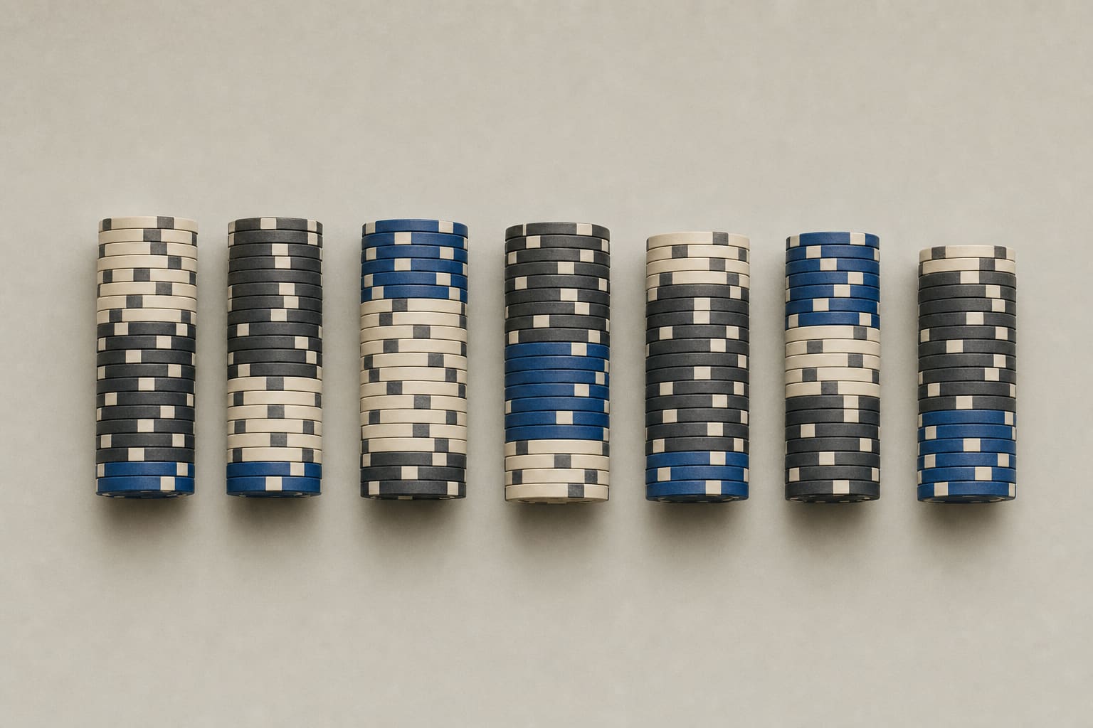 Several distinct arrangements of casino chip stacks lined up side by side like specimens