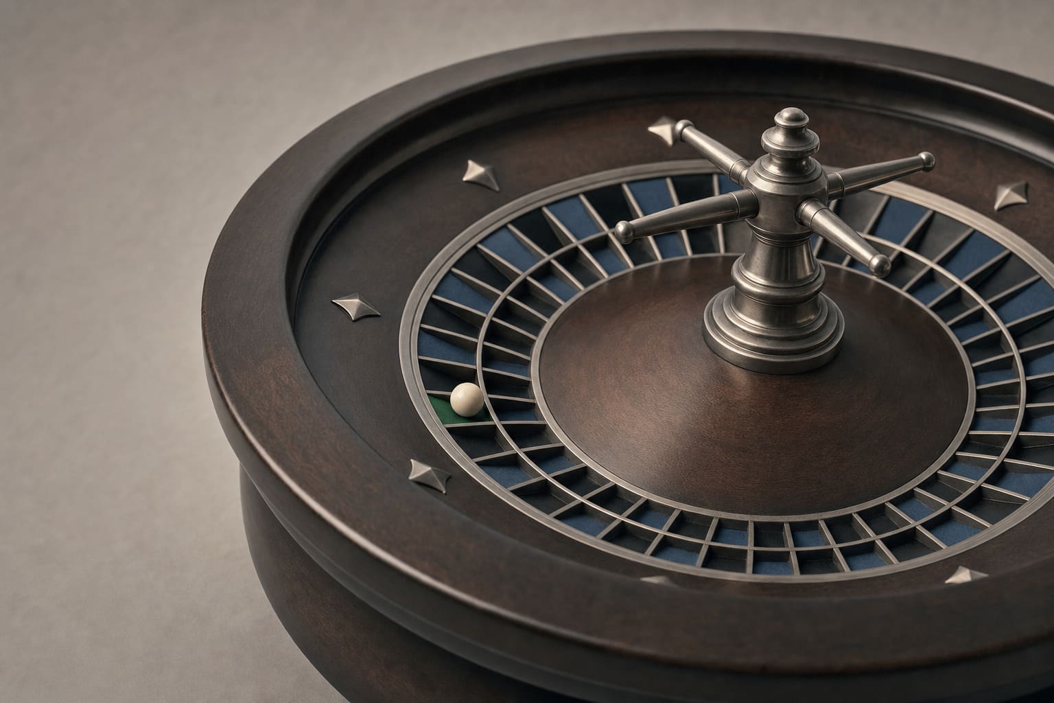 A classic European roulette wheel at rest with the ivory ball in a pocket